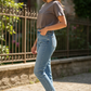 Mocha Brown Premium Tee - Female Model Side Pose