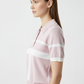 Model wearing pink polo - 3/4 angle